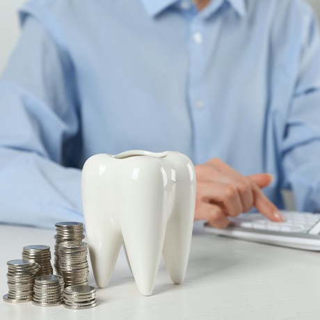 A patient using a calculator to estimate the cost of teeth whitening