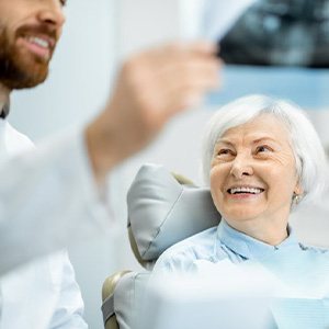 Dentist showing a patient their X-ray